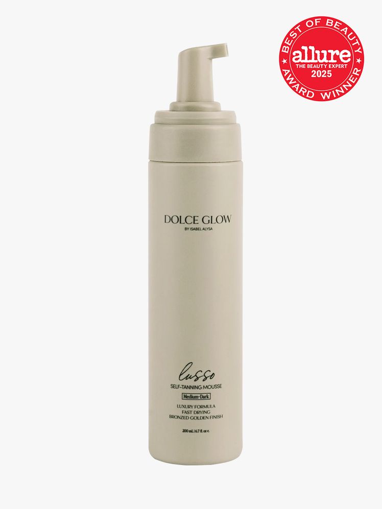 Dolce Glow Lusso SelfTanning Mousse in branded taupe bottle with foam pump on light gray background with red Allure Best...