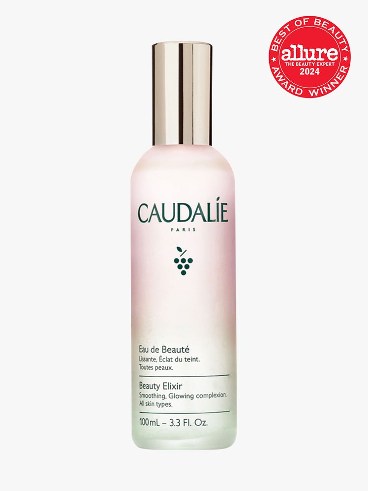 facial mist in branded gradient bottle with soft gold cap on light gray background with red and white 2024 allure best...