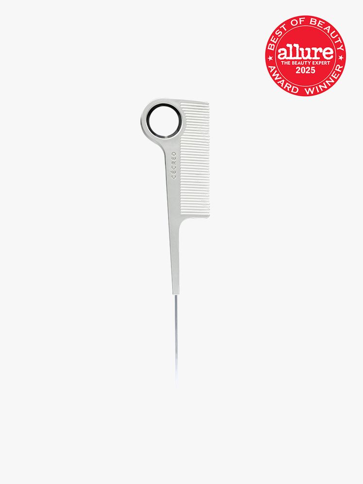 Ccred Parting Tail Comb in silver and black color way on light gray background with red Allure Best of Beauty seal in...