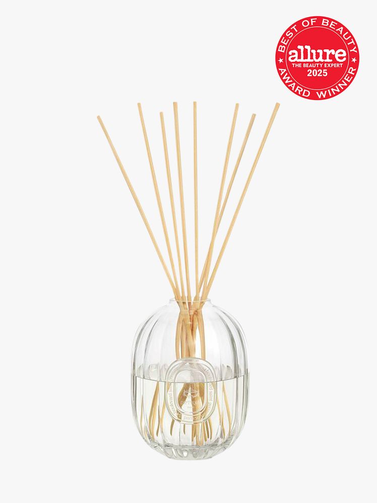 Diptyque Home Fragrance Diffuser in 2L branded clear bottle on light gray background with red Allure Best of Beauty seal...