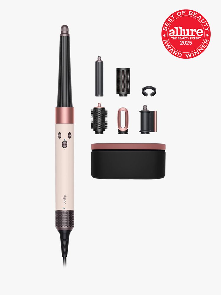 Dyson Airwrap i.d. set in black and pink color way on light gray background with red Allure Best of Beauty seal in the...