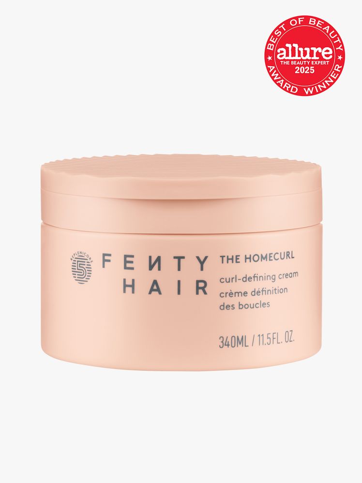 Fenty Hair The Homecurl CurlDefining Cream in branded coral jar with snap lid closure on light gray background with red...