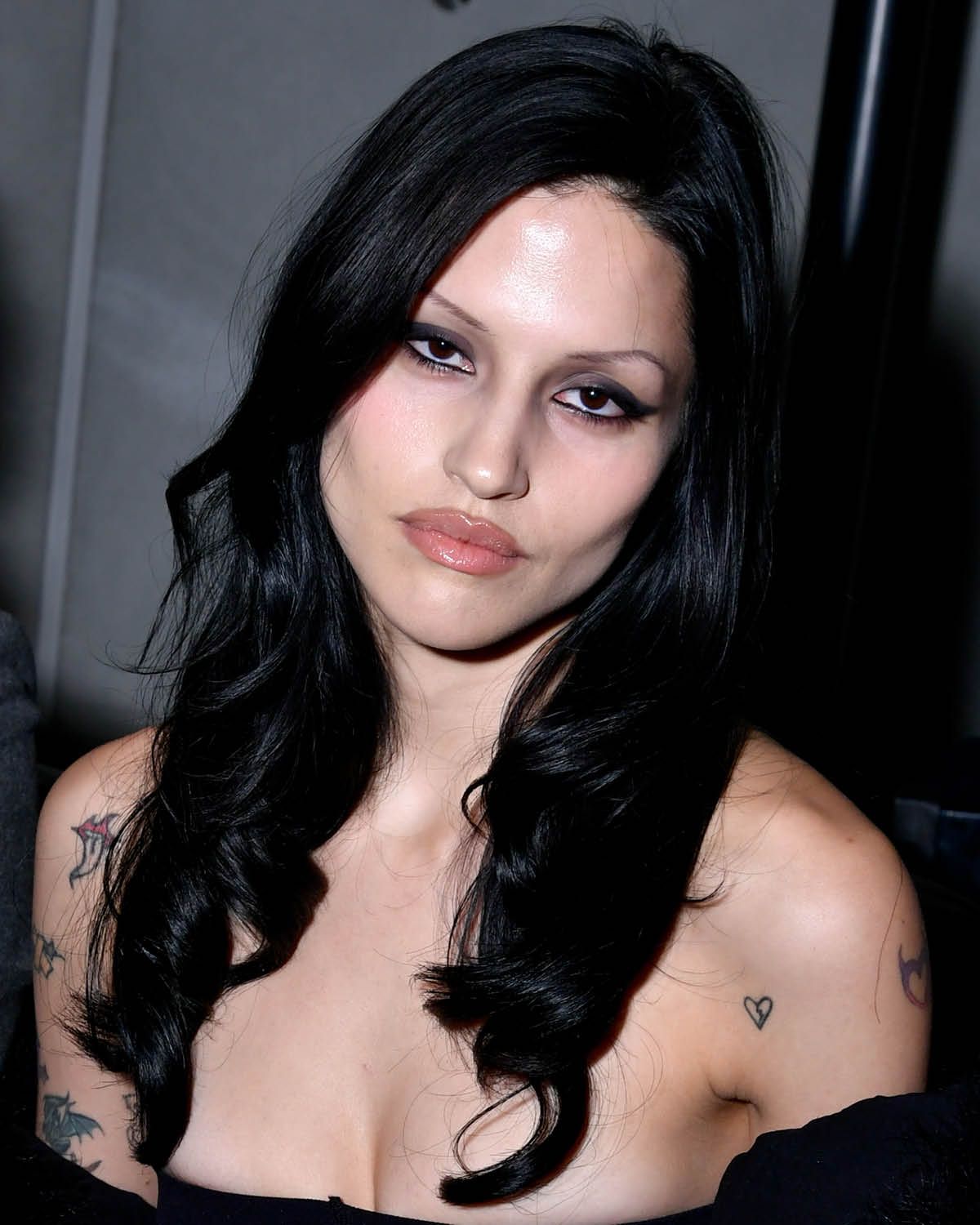 model gabriette with gray eye shadow and black winged eyeliner goth makeup inspiration