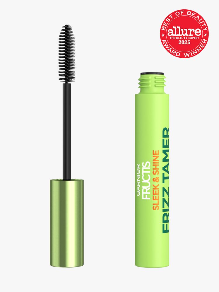 Garnier Fructis Sleek  Shine Frizz Tamer in green tube next to brush applicator on light gray background with red Allure...