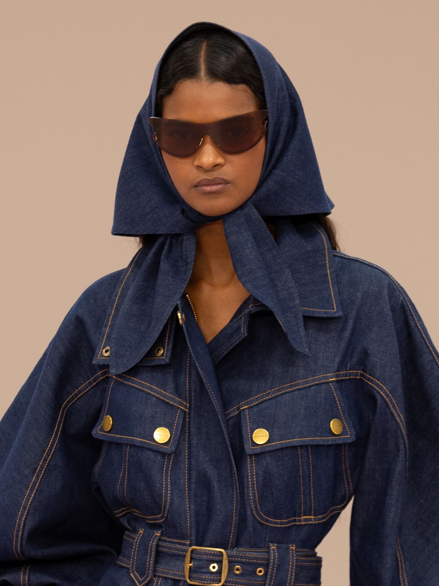 A model walks the runway during the Zimmermann Womenswear SpringSummer 2026 show in a mini denim dress and matching...