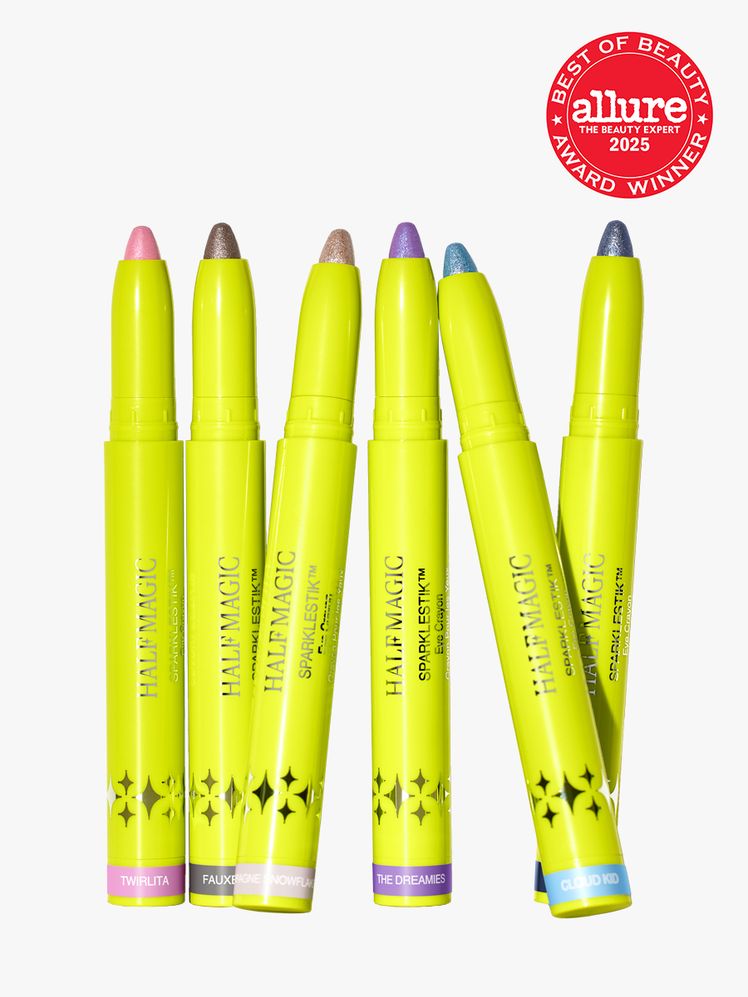 Half Magic Sparklestik Eye Crayons in branded yellow twist up applicators on light gray background with red Allure Best...