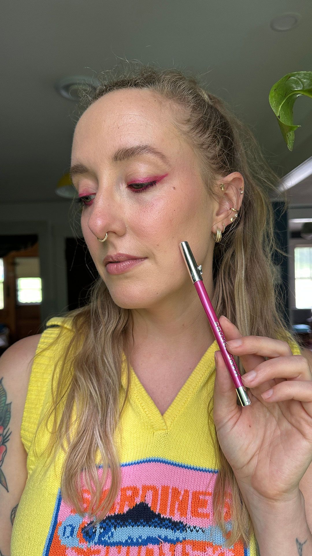 photo of woman wearing pink eyeliner