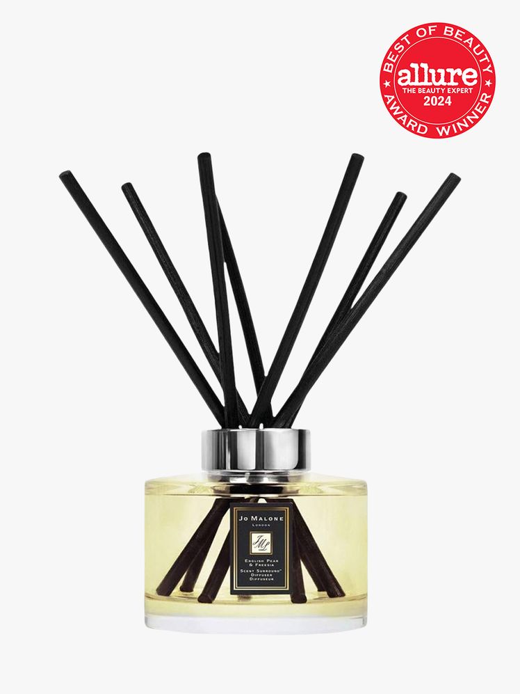 Jo Malone London English Pear Freesia Diffuser clear branded component with silver accents on a light gray background...