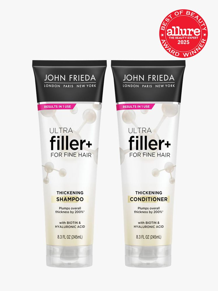 John Frieda ULTRAFiller Shampoo and Conditioner two white tubes of shampoo and conditioner on light gray background with...