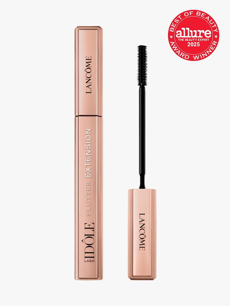 Lancôme Lash Idôle Flutter Extension Lengthening Mascara rose gold tube of mascara on light gray background with red...