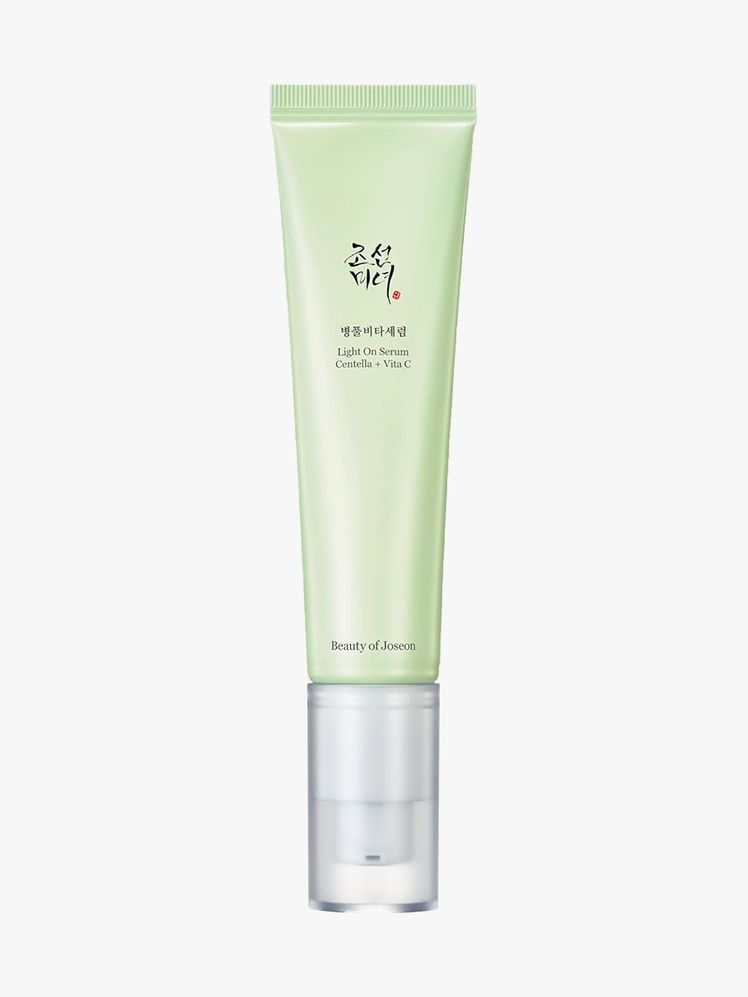 Light On Serum Centella Vita C light green tube on light gray background