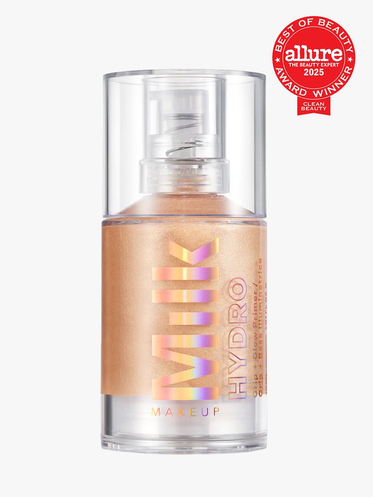 Milk Makeup Hydro Grip  Glow Primer in branded clear bottle with pump on light gray background with red Allure Best of...
