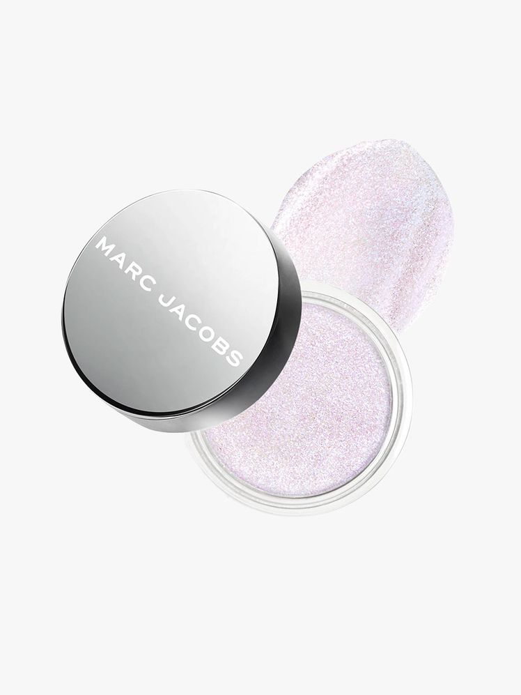 Container of Marc Jacobs Beauty Money Shot Highlighter with silver cap on light gray background