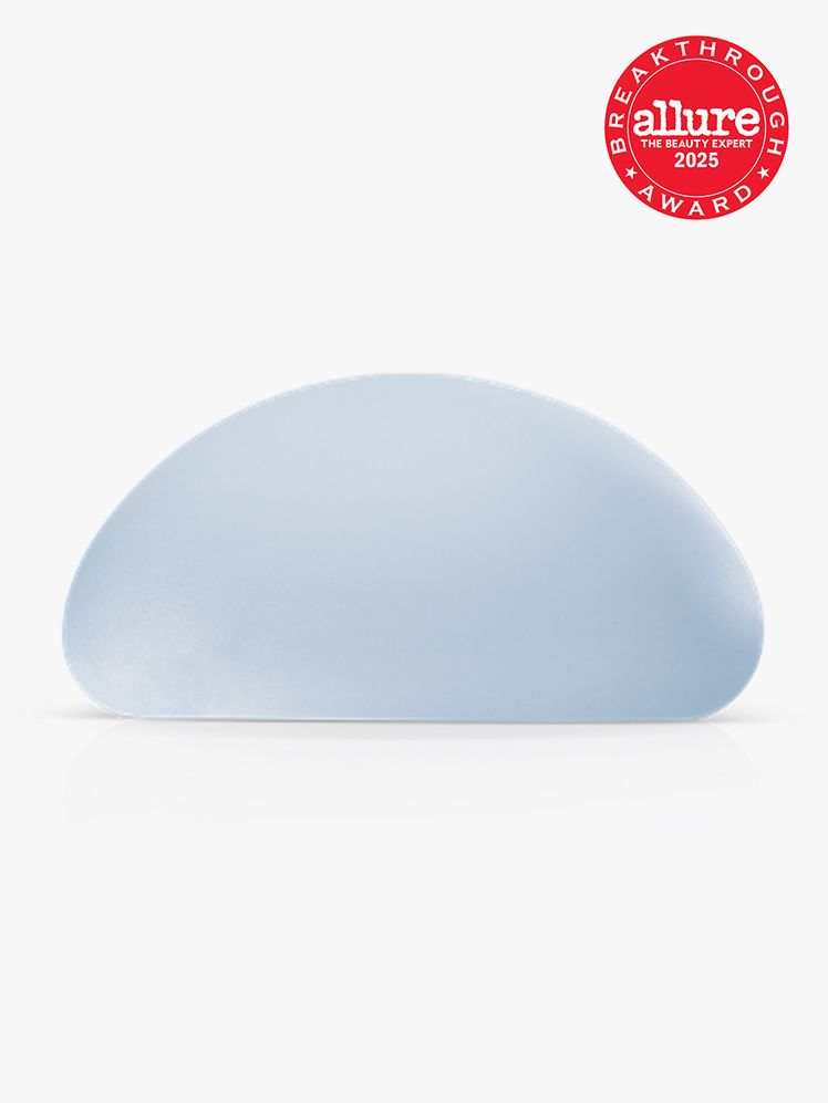 Motiva by Establishment Labs SmoothSilk Round  Ergonomix Implants light blue implant on light gray background with red...