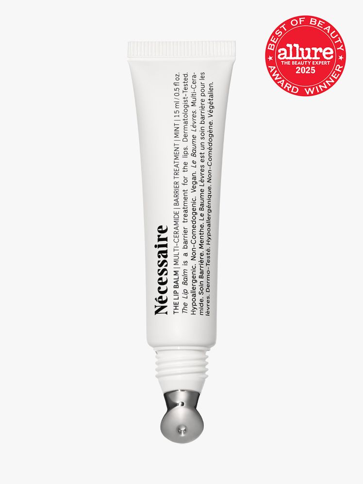 The Lip Balm in branded white tube with metal applicator on light gray background with red Allure Best of Beauty seal in...