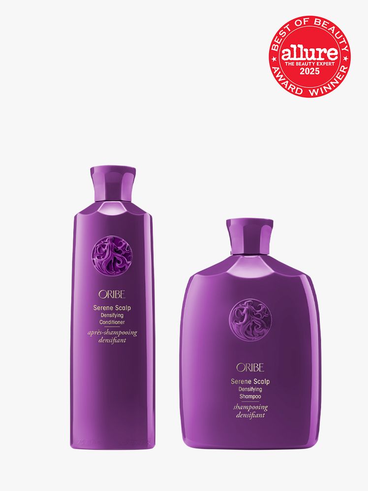 Oribe Serene Scalp Densifying Shampoo and Serene Scalp Densifying Conditioner set in branded purple color way on light...