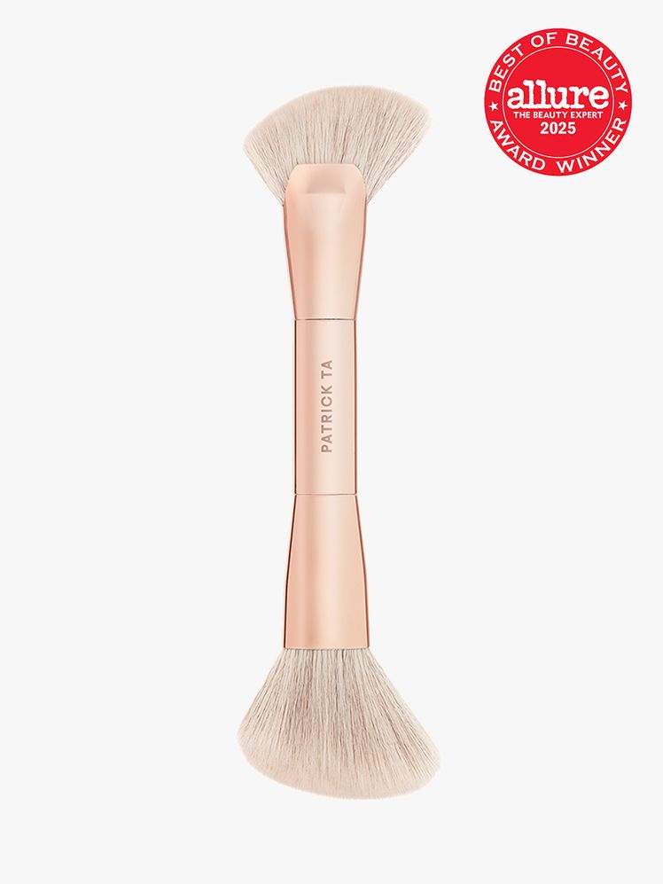 Patrick Ta Major Sculpt DualEnded Sculpting Brush with rose gold handle on light gray background with red Allure Best of...