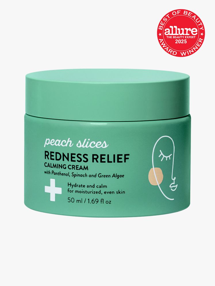 Peach Slices Redness Relief Calming Cream in branded green jar with twist cap on light gray background with red Allure...