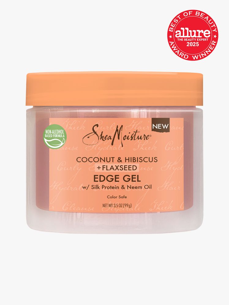 SheaMoisture Coconut  Hibiscus  Flaxseed Edge Gel in branded clear and orange jar with twist cap on light gray...