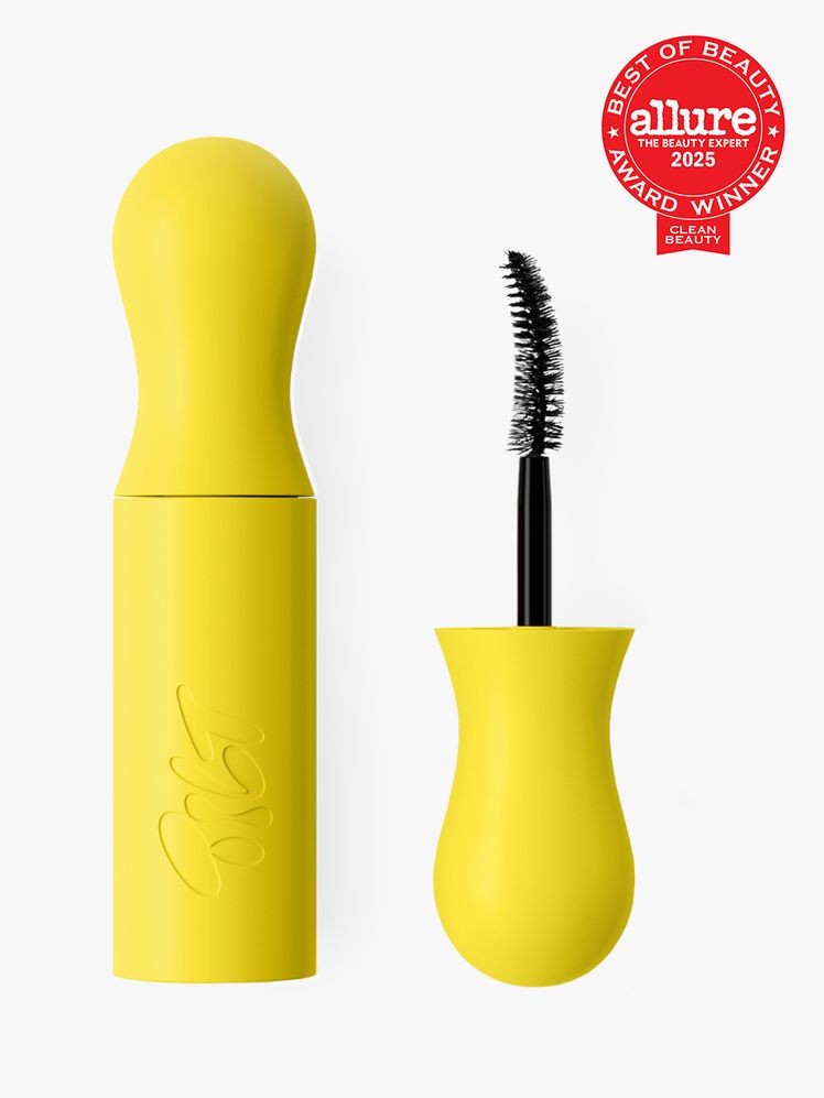 Tilt Beauty Lashscape Mascara in branded yellow tube next to brush applicator cap on light gray background with red...