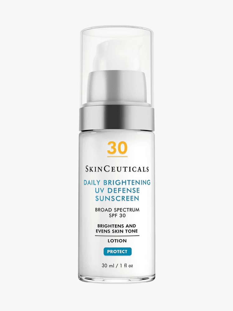 Daily Brightening UV Defense Sunscreen SPF 30 in clear bottle with pump on light gray background