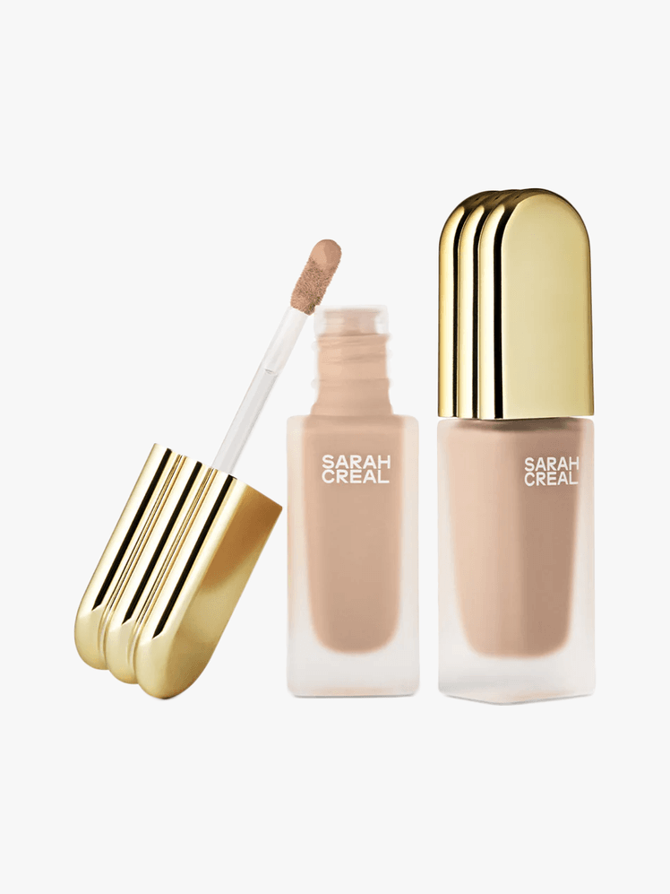 Face Flex Concealer Complexion Enhancer in Light Neutral in branded frosted glass packaging with gold cap and doe foot...