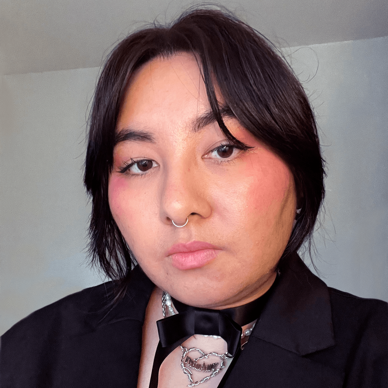 headshot of Logan Tsugita Allure Associate Director Programming  Creative Development